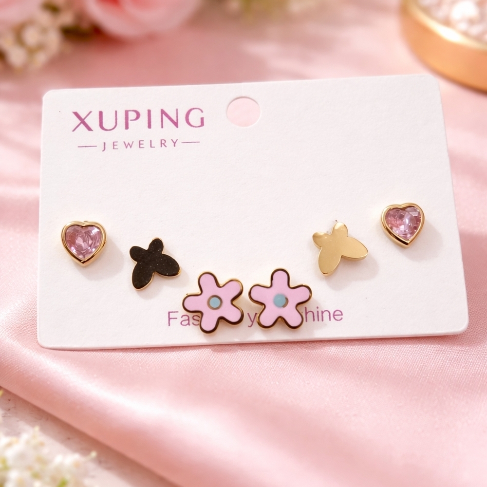 Set of pink heart, flower, and butterfly earrings.